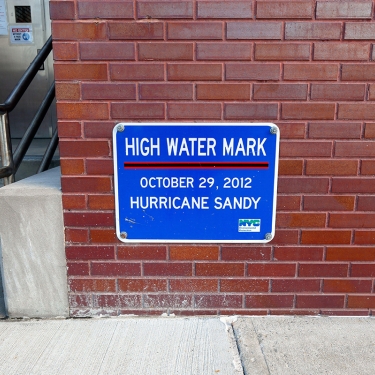 &quot;High Water Mark&quot; signage commemorating the highest point of flooding at this particular location during Hurricane Sandy, New York, NY.